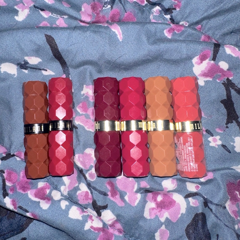 Six MILANI lipsticks and lipstick gloss. Never worn just swatched. Great colors